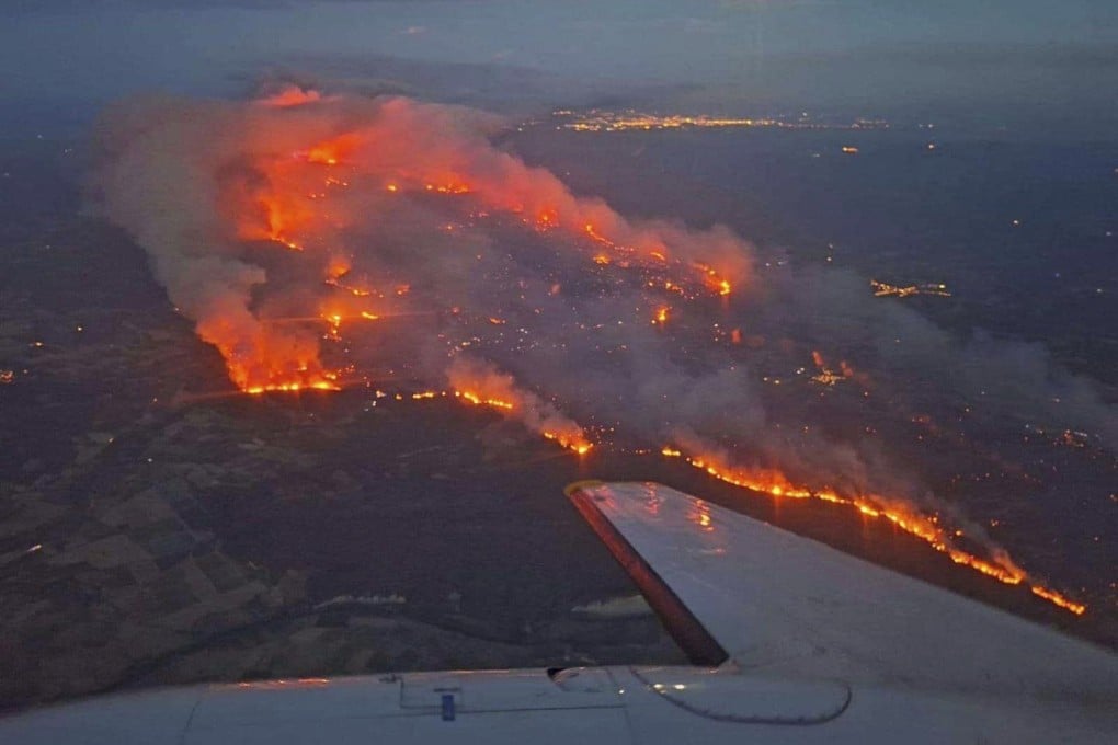 A wildfire in a Mediterranean region near the Spanish border, southern France, is seen from the air on Tuesday. Photo: Securite Civile via AP