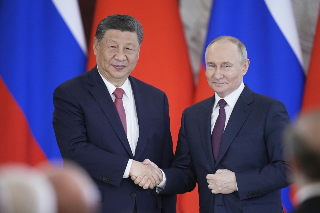 Russian President Vladimir Putin (right) and Chinese President Xi Jinping shake hands at the Kremlin in Moscow, Russia on May 8. Photo: AP