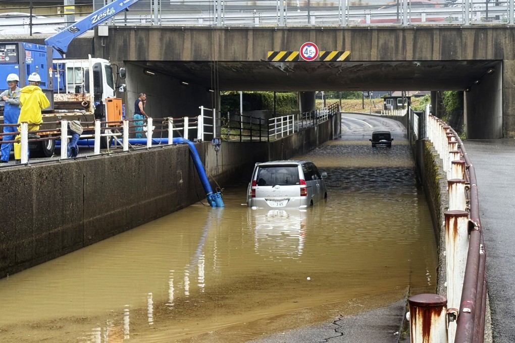 Cars trapped by floods are seen in Kanazawa, central Japan’s Ishikawa prefecture, following the record rainfall. Photo: Kyodo