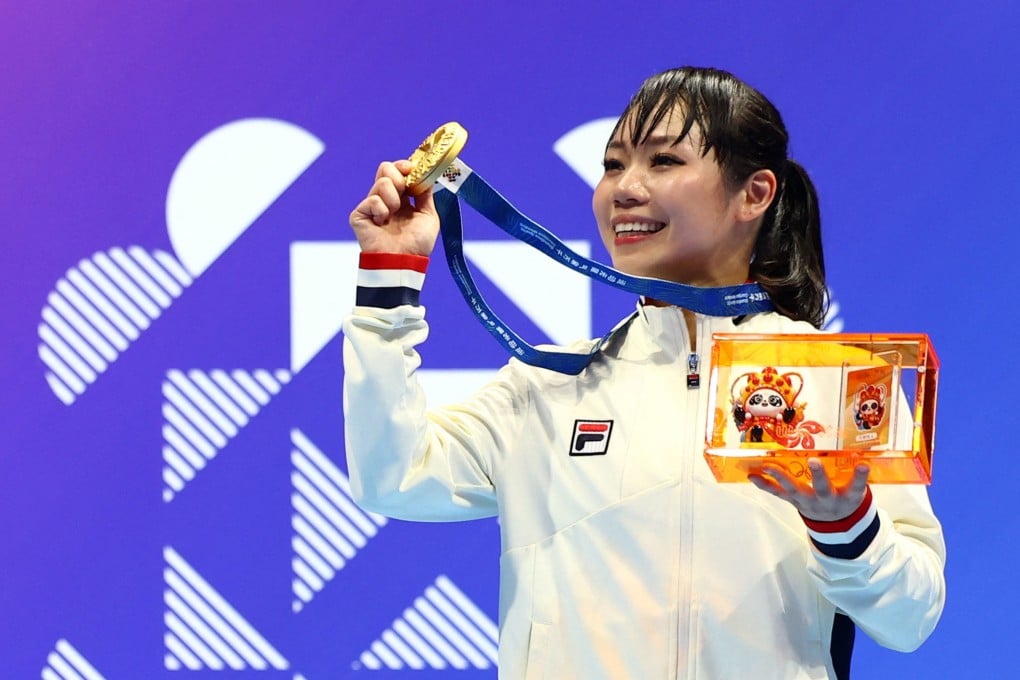 Grace Lau celebrates on the podium after winning Hong Kong’s first medal at the World Games in Chengdu in the karate kata event on Friday. Photo: Reuters