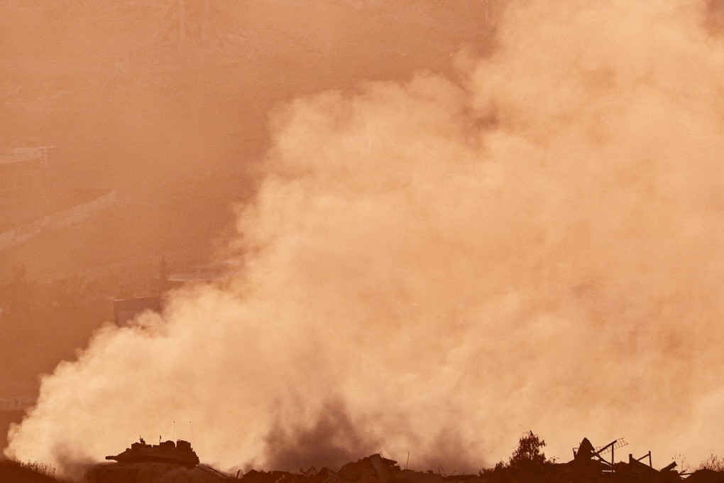 An Israeli tank carries out manoeuvres in Gaza as seen from the Israeli side of the border on July 28. Photo: Reuters