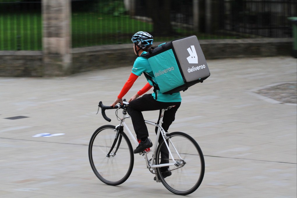 A cyclist from the food delivery company Deliveroo speeding through city streets. British immigration enforcement officers stopped and questioned 1,780 individuals between July 20 and 27 and 280 people were arrested. Photo: Shutterstock