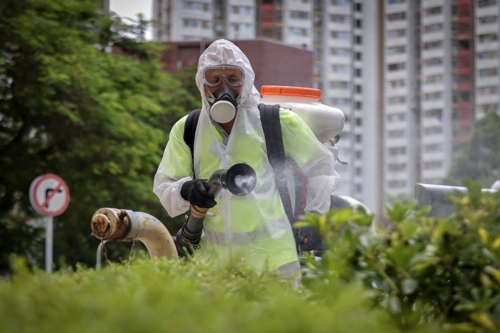 A worker from the Food and Environmental Hygiene Department carries out Aedes mosquito control work at Lei Tung Estate. Photo: Karma Lo