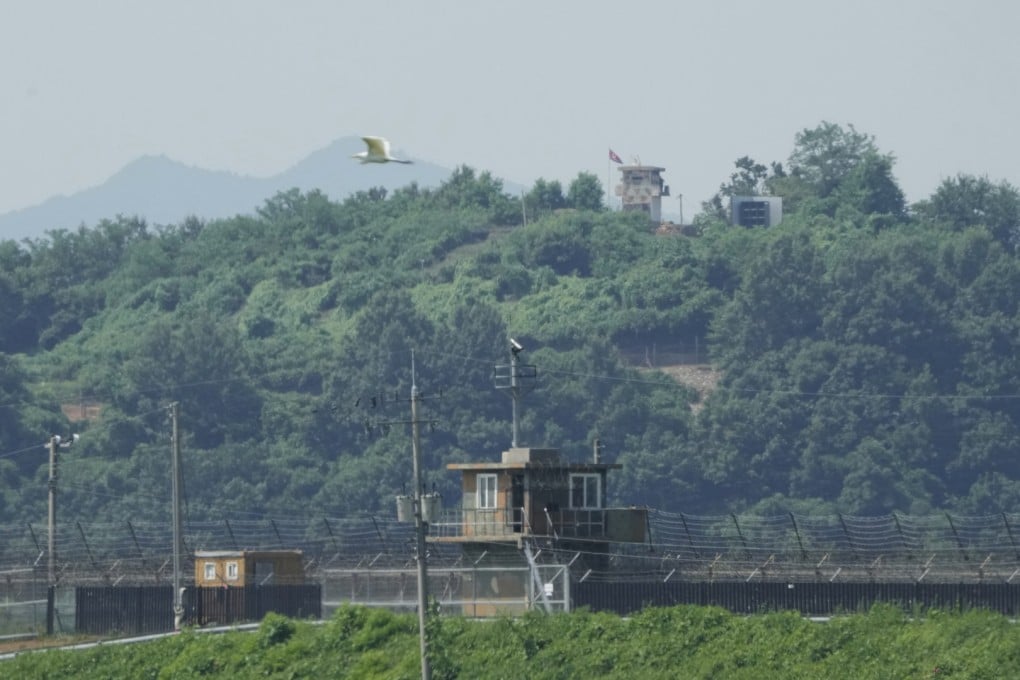 A North Korean military guard post, loudspeaker (top right), and South Korean military guard post (bottom) as seen from Paju, South Korea, near the border with North Korea, on Monday. Photo AP