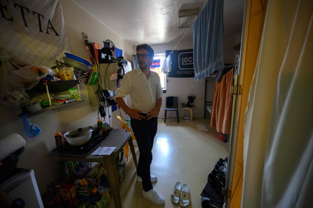 French left-wing La France Insoumise (LFI) party MP Hadrien Clouet inspects a cell as he visits the detention center in Seysses, south-western France, on Thursday. Photo: AFP