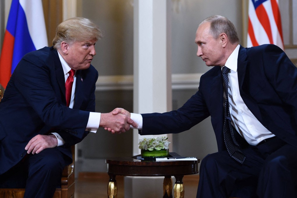 US President Donald Trump and Russian President Vladimir Putin shake hands before a meeting in Helsinki in July 2018. Photo: AFP