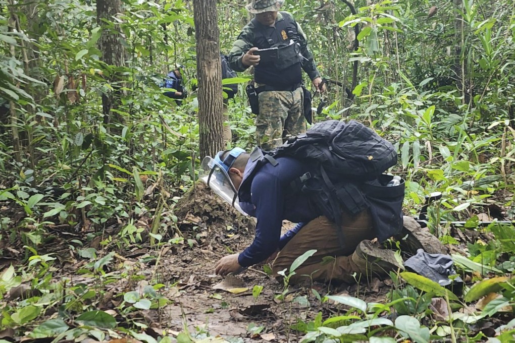 Thai soldiers inspect a border area in Ubon Ratchathani province, where the Royal Thai Army said two anti-personnel landmines were found, on July 20. Photo: AP