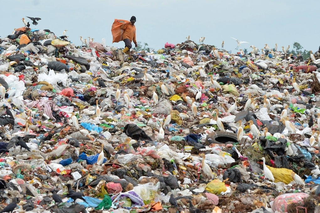 A worker sorts plastic waste on the outskirts of Sri Lanka’s capital Colombo. Photo: AFP