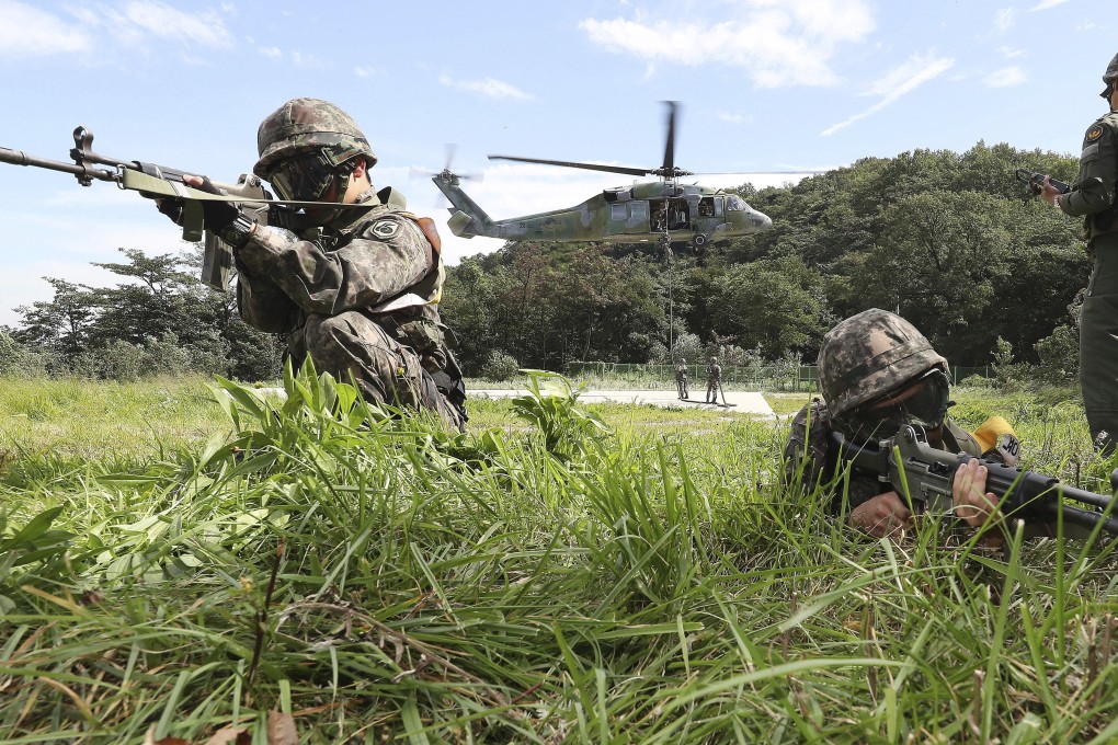 South Korean soldiers aim their machine guns during the annual US-South Korea military drills in 2017. Photo: Yonhap/AP