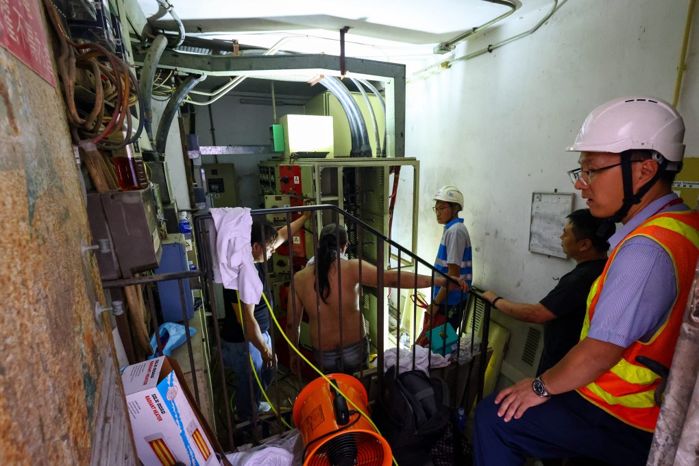 Workers conduct emergency repairs in the electricity room of Ming Yuen Centre in North Point. Photo: Dickson Lee