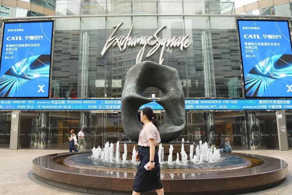 A pedestrian passes a fountain at Exchange Square in Hong Kong’s Central district on May 20. Photo: Xinhua