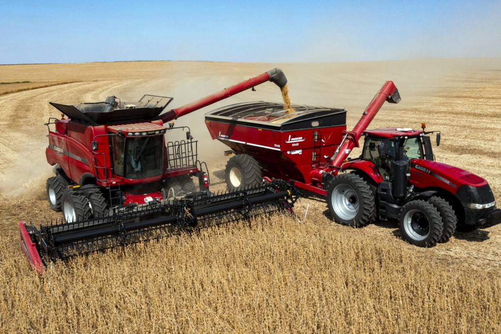 Jason Kwapi operates a combine during soybean harvesting in Iowa last year. Photo: AP