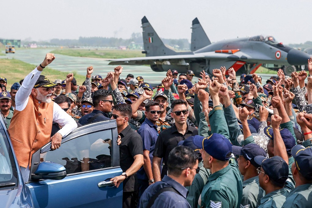 India’s Prime Minister Narendra Modi (left) during a visit to Adampur Airforce Base in Punjab. Photo: Indian Press Information Bureau / AFP
