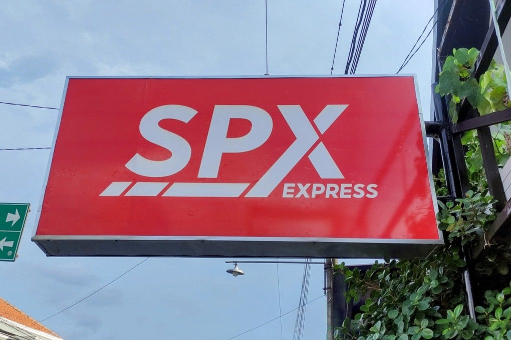 An orange SPX Express sign in Indonesia. SPX collection points in Southeast Asia’s largest economy operate out of small family shops that double as pickup depots. Photo: Shutterstock