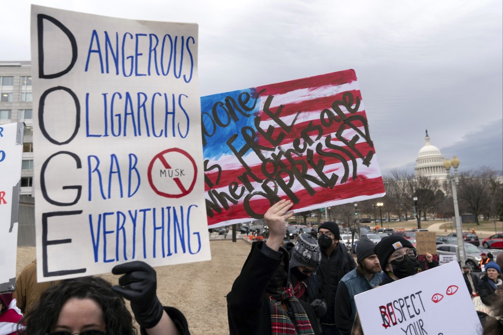 People protest during a rally against Elon Musk outside the US Department of Labor in Washington in February. Photo: AP