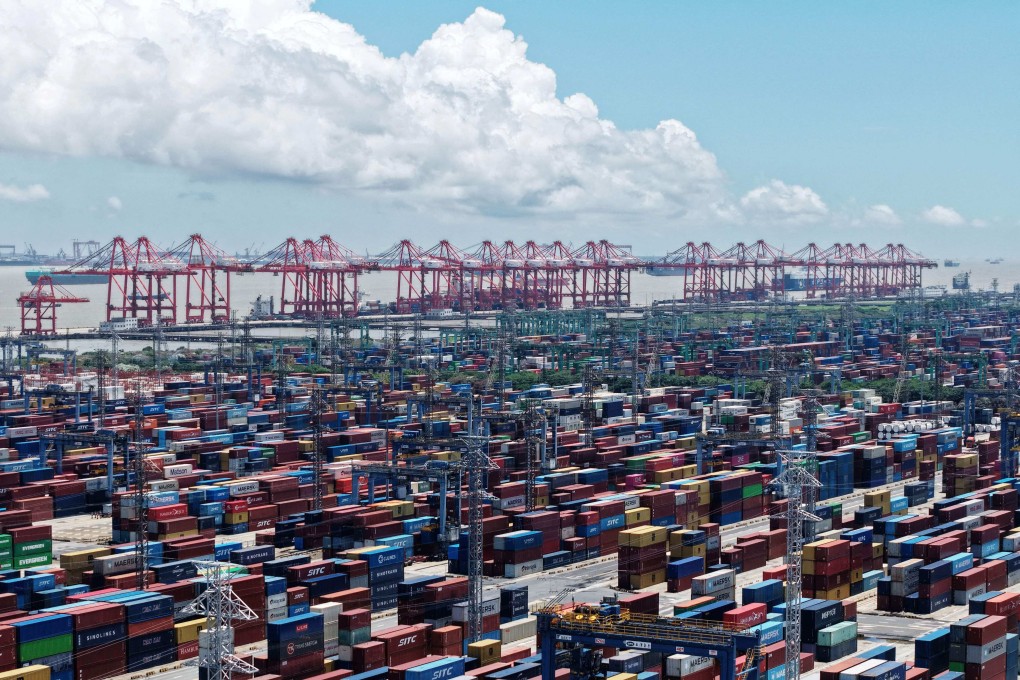Containers are seen at a port in Shanghai on Thursday. The latest shipping rates from Shanghai to the US west coast and east coast have fallen by more than half from their peak in early June. Photo: AFP