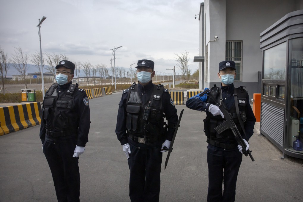 Officers at the entrance of a detention centre in China’s Xinjiang Uygur autonomous region on April 23, 2021. The US State Department’s annual review of China’s human rights record continued to cite Beijing’s treatment of Uygurs and other Muslim minorities there. Photo: AP