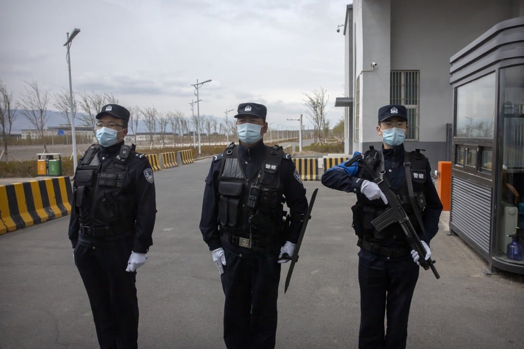 Officers at the entrance of a detention centre in China’s Xinjiang Uygur autonomous region on April 23, 2021. The US State Department’s annual review of China’s human rights record continued to cite Beijing’s treatment of Uygurs and other Muslim minorities there. Photo: AP