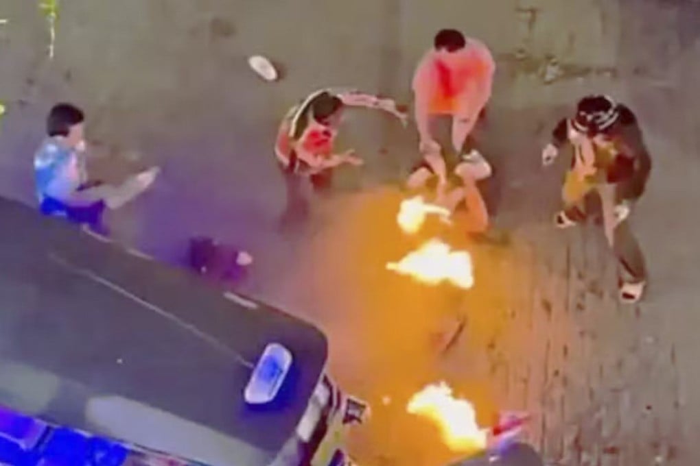 Two Malaysian tourists sitting in front of the popular Big C shopping centre in Bangkok were set on fire on Thursday last week. Photo: Handout