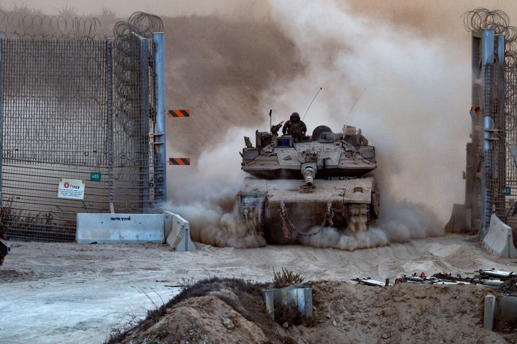 An Israeli tank enters Israel from Gaza last month. Photo: Reuters