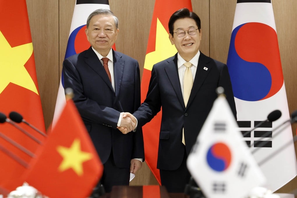 South Korean President Lee Jae-myung (right) shakes hands with To Lam, general secretary of Vietnam’s Communist Party, in Seoul on Monday. Photo: Yonhap/dpa