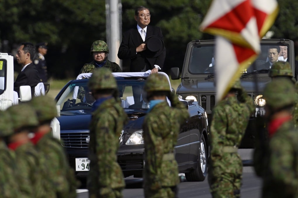 Japanese Prime Minister Shigeru Ishiba reviews troops at the Ground Self-Defence Force Camp in Asaka on November 9 last year. Photo: EPA-EFE