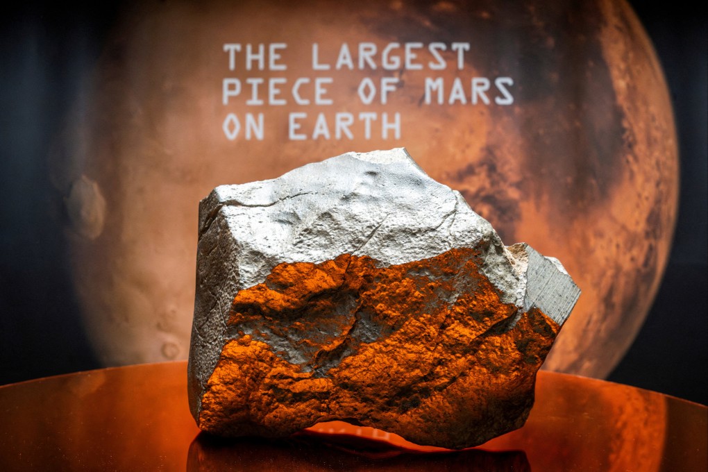 The Martian meteorite NWA 16788 is displayed during a Sotheby’s auction preview in New York City on July 8. Photo: Reuters