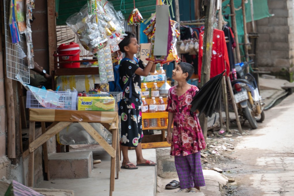 Young children browse for snacks at a provision shop in Mae La Camp on August 5. Photo: Janelle Ling