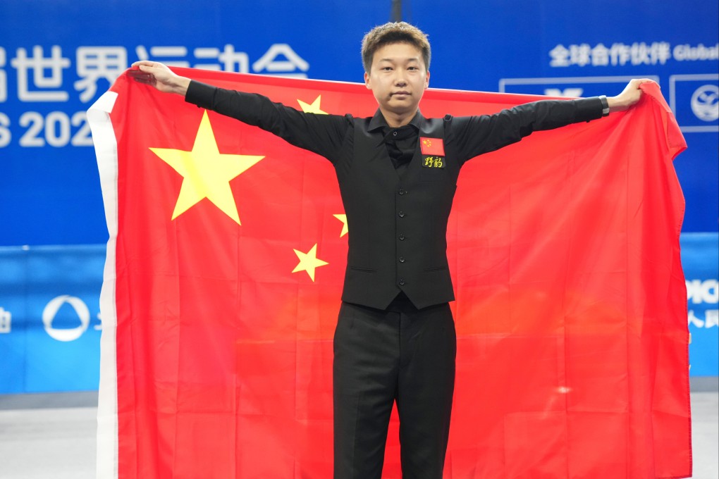 Zhang Taiyi celebrates his heyball victory over Jason Theron of South Africa on Thursday. Photo: Xinhua