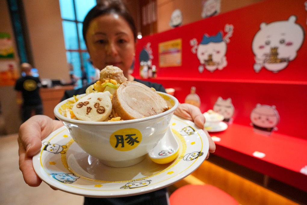 A staff member of Chiikawa Ramen Buta shows off a bowl of noodles at the new manga-themed restaurant in Mong Kok. Photo: May Tse