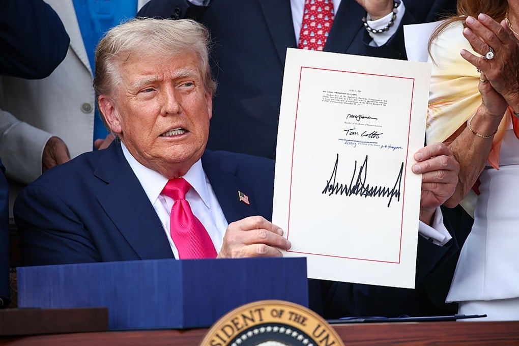 US President Donald Trump signs the One Big Beautiful Bill Act into law on July 4, 2025, in Washington. Photo: Getty Images/TNS