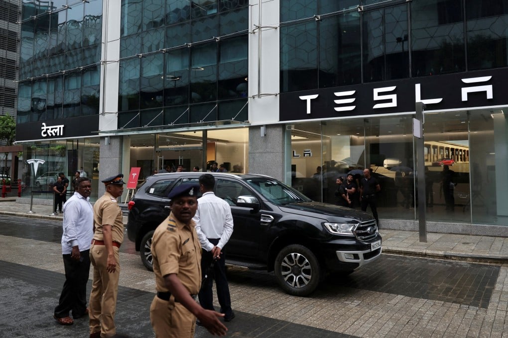 Police in Mumbai direct traffic outside Tesla’s first showroom in India ahead of its opening last month. Photo: Reuters