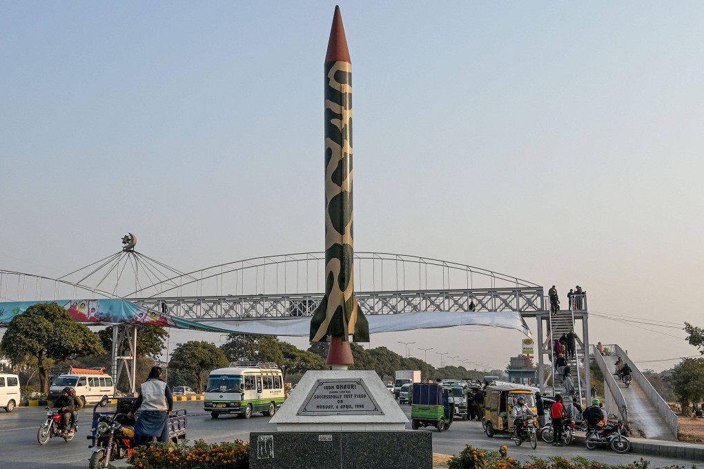 Commuters ride past a replica of a Pakistani ballistic missile along a road in Islamabad last year. Photo: AFP