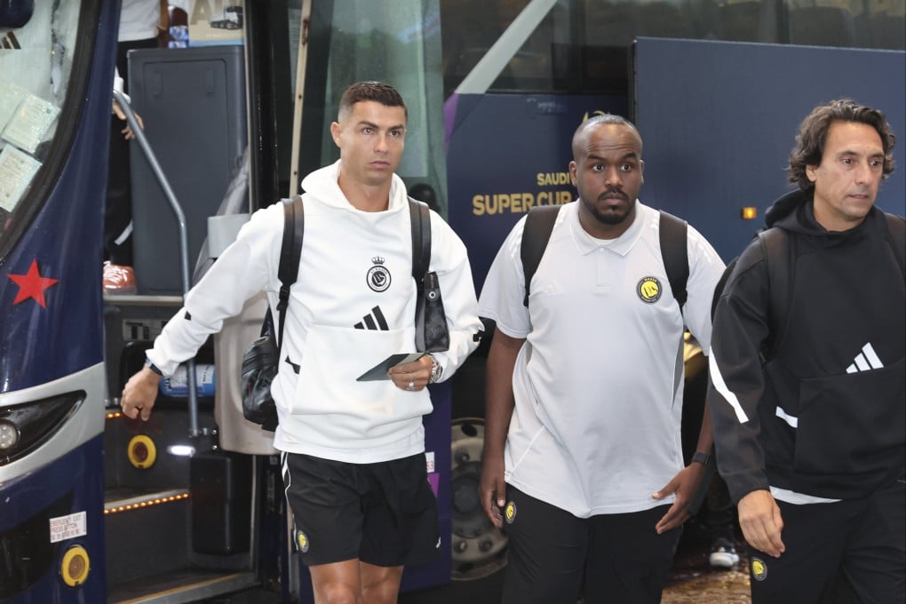 Cristiano Ronaldo (left) arrives at the Regent Hong Kong hotel on Thursday. Photo: Dickson Lee