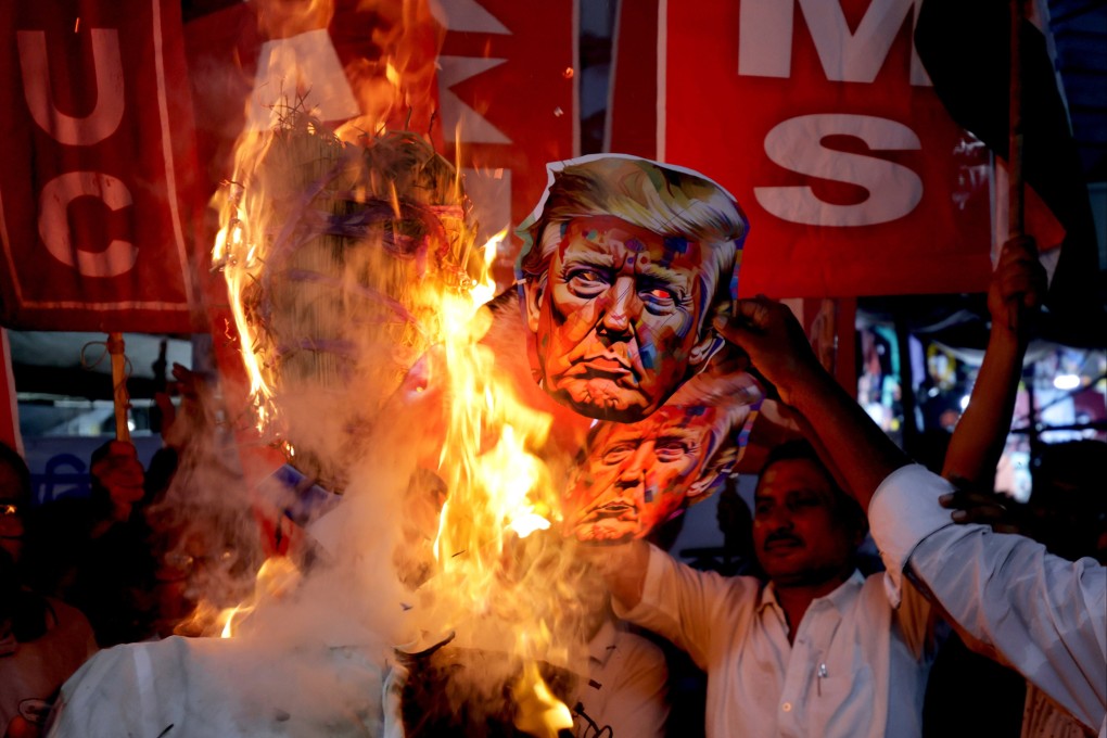 Activists protest against US President Donald Trump and his trade policies for India outside the US embassy in Kolkata on August 13. In an escalation of trade tensions between the United States and India, Trump announced additional tariffs of 25 per cent on Indian goods which would bring the total to 50 per cent. Photo: EPA
