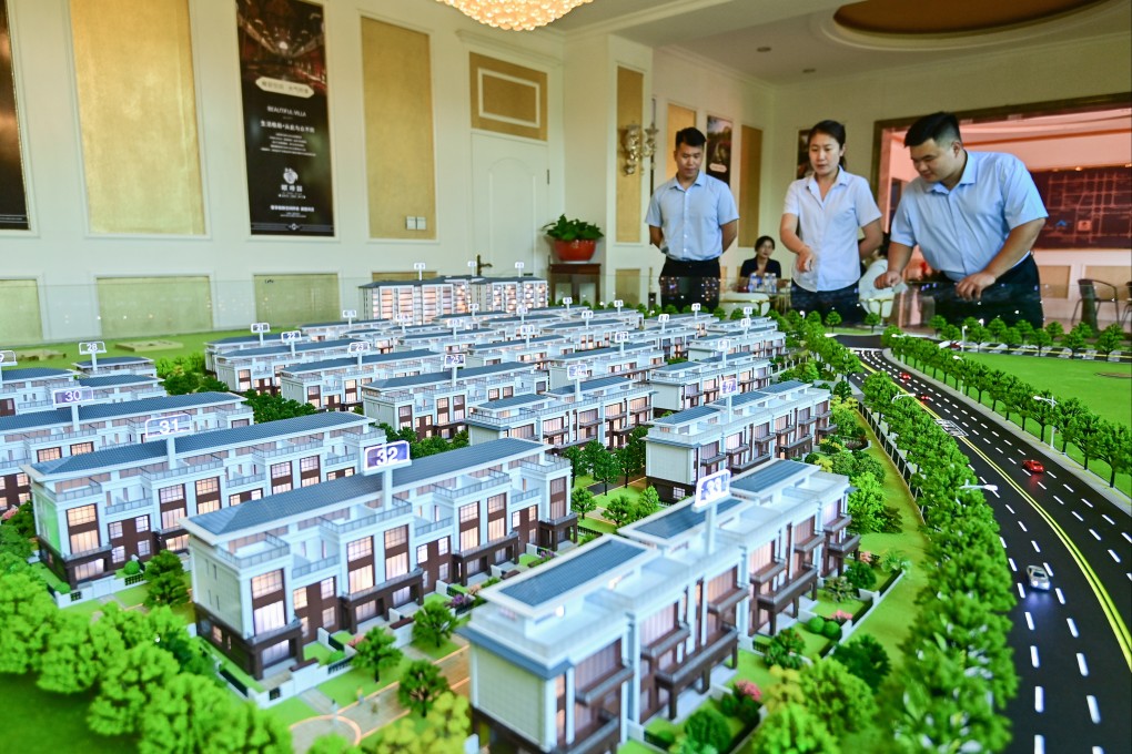 Chinese citizens at the sales office of a commercial residential property development in Qingzhou city, Shandong province, on June 16. Photo: CFOTO/Future Publishing via Getty Images