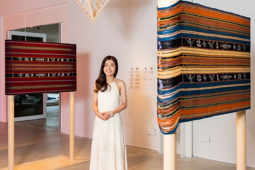 Hong Kong artist Mandy Ma stands with her hand-woven work Where Moments Gather (2025) at an exhibition at the Centre for Heritage, Arts and Textile in Tsuen Wan. Ma is one of a group of artists whose work highlighting traditional crafts is being showcased at the exhibition. Photo: courtesy of Chat