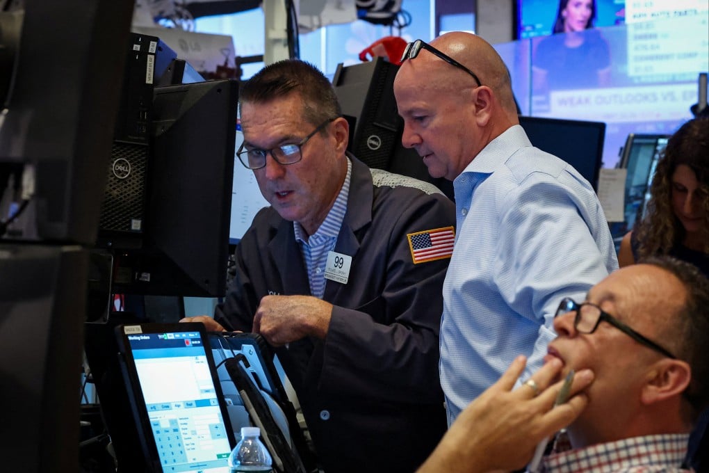 Traders work on the floor at the New York Stock Exchange in on August 14. Photo: Reuters
