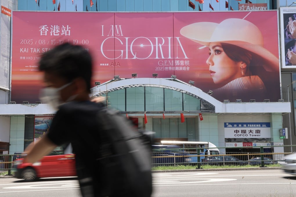 A pedestrian walks past a concert poster in Causeway Bay on July 4. Photo: Jelly Tse