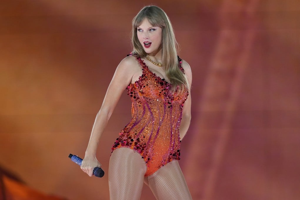 Taylor Swift wears an orange outfit as she performs at the Paris La Defense Arena during her Eras Tour concert in Paris, on May 9, 2024. The colour is being strongly associated with her new album, The Life of a Showgirl. Photo: AP