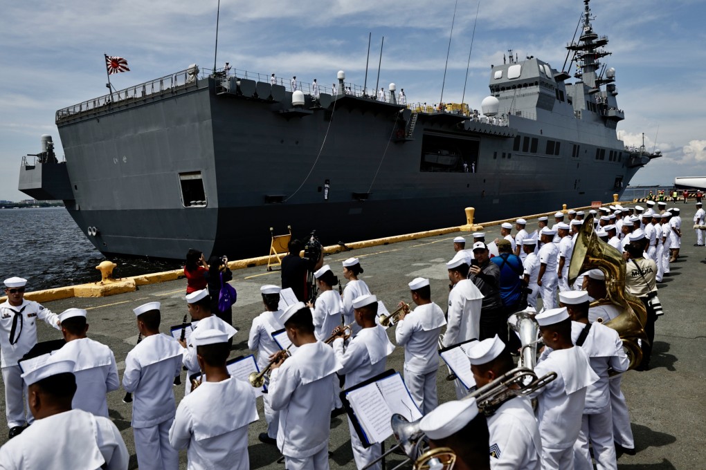 A commentary in China’s PLA Daily has accused Tokyo of rolling back post-war restrictions using US support. Photo: EPA-EFE