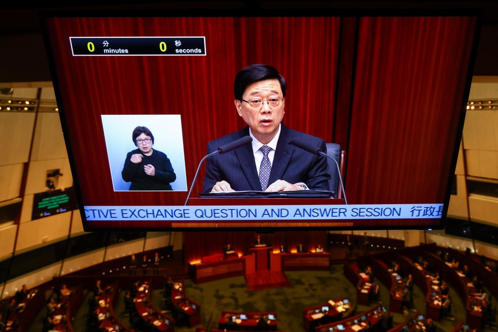 Chief Executive John Lee is seen on a big screen during a question and answer session in the Legislative Council chamber in Admiralty on May 29. Photo: Dickson Lee