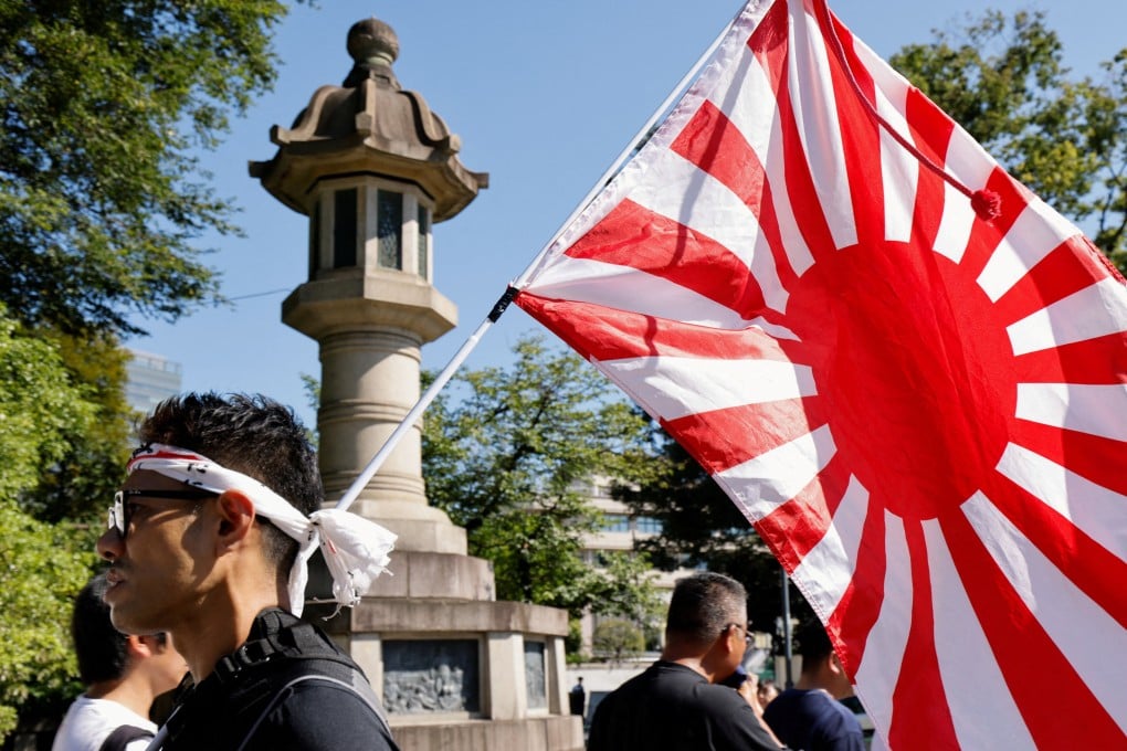 A “rising sun” flag, associated with Japan’s militaristic and imperial past, is seen at the Yasukuni Shrine in Tokyo on August 15, the 80th anniversary of Japan’s surrender in World War II. China’s Foreign Minister Wang Yi said Japan has attempted to “glorify aggression, deny it, distort history and even whitewash the war criminals of that time”. Photo: Reuters