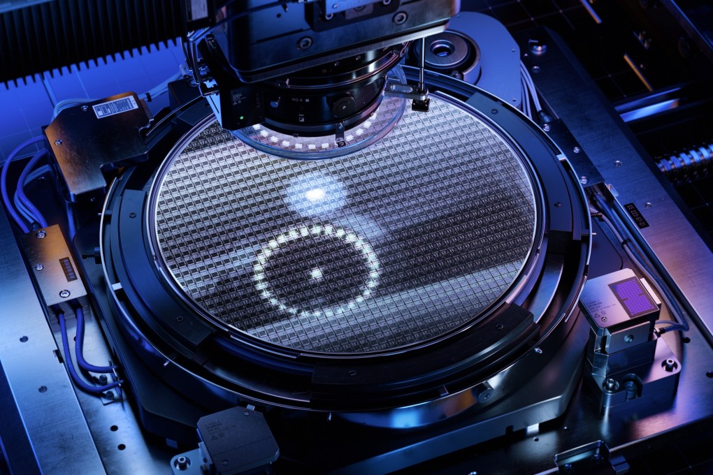 A silicon wafer undergoes the photolithography process in the clean room of a wafer foundry. Photo: Shutterstock Images