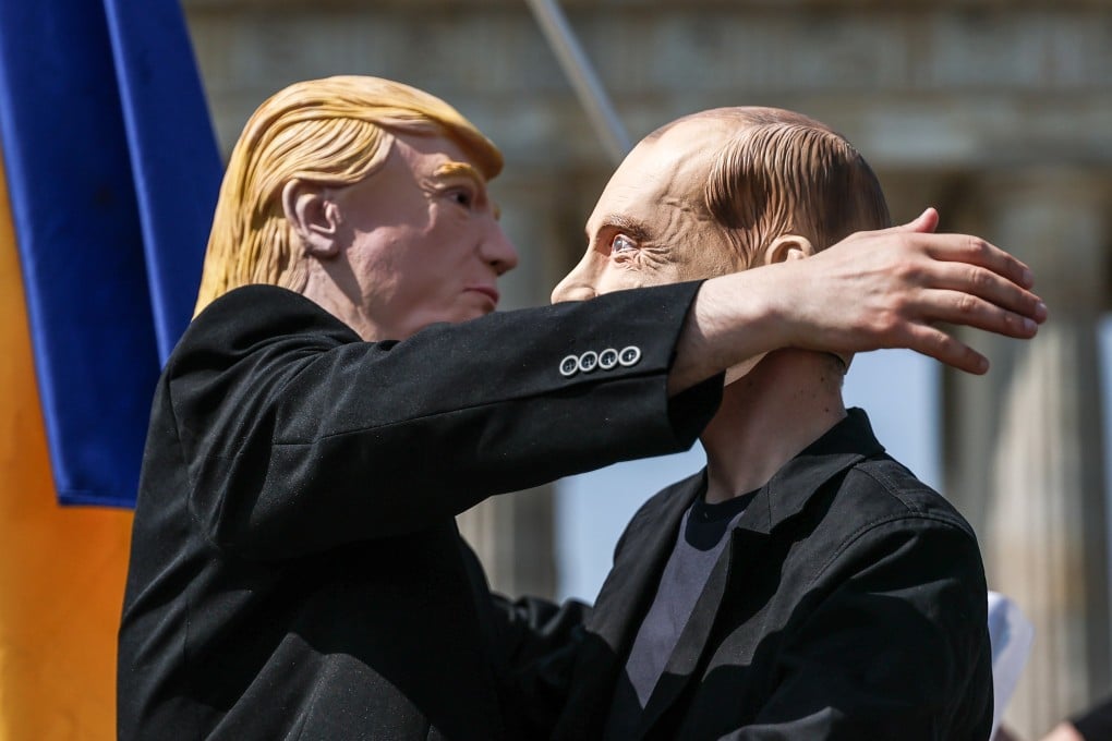 Activists in Trump and Putin masks embrace during a protest in Berlin, Germany, on Thursday. Photo: EPA