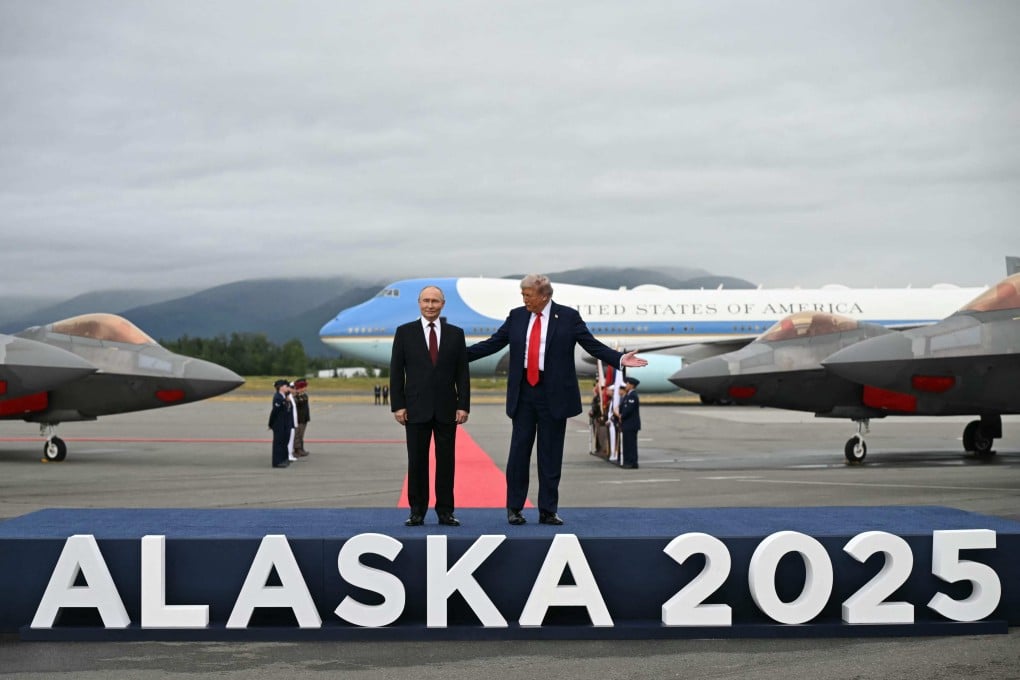 US President Donald Trump and Russian President Vladimir Putin pose on a podium on the tarmac after they arrived at Joint Base Elmendorf-Richardson in Anchorage, Alaska, for their summit on Friday. Photo: AFP