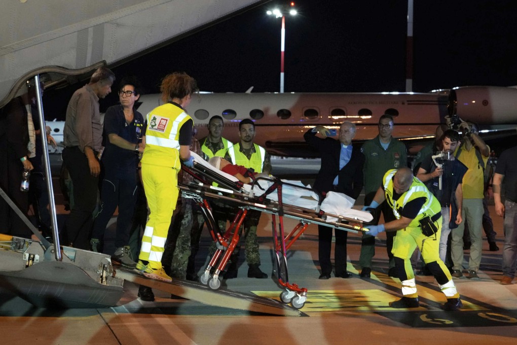 Palestinian children and their families evacuated from Gaza arrive at Rome’s Ciampino military airport on Thursday. Photo: AP