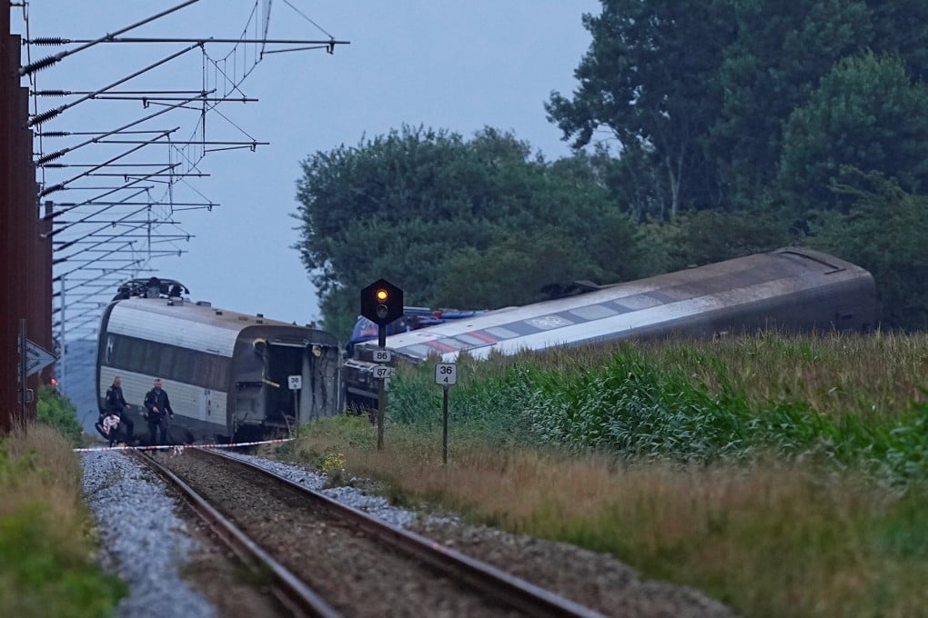 A derailed passenger train is seen in the village of Bjerndrup in Southern Jutland, Denmark, on Friday. Photo: Ritzau Scanpix via Reuters