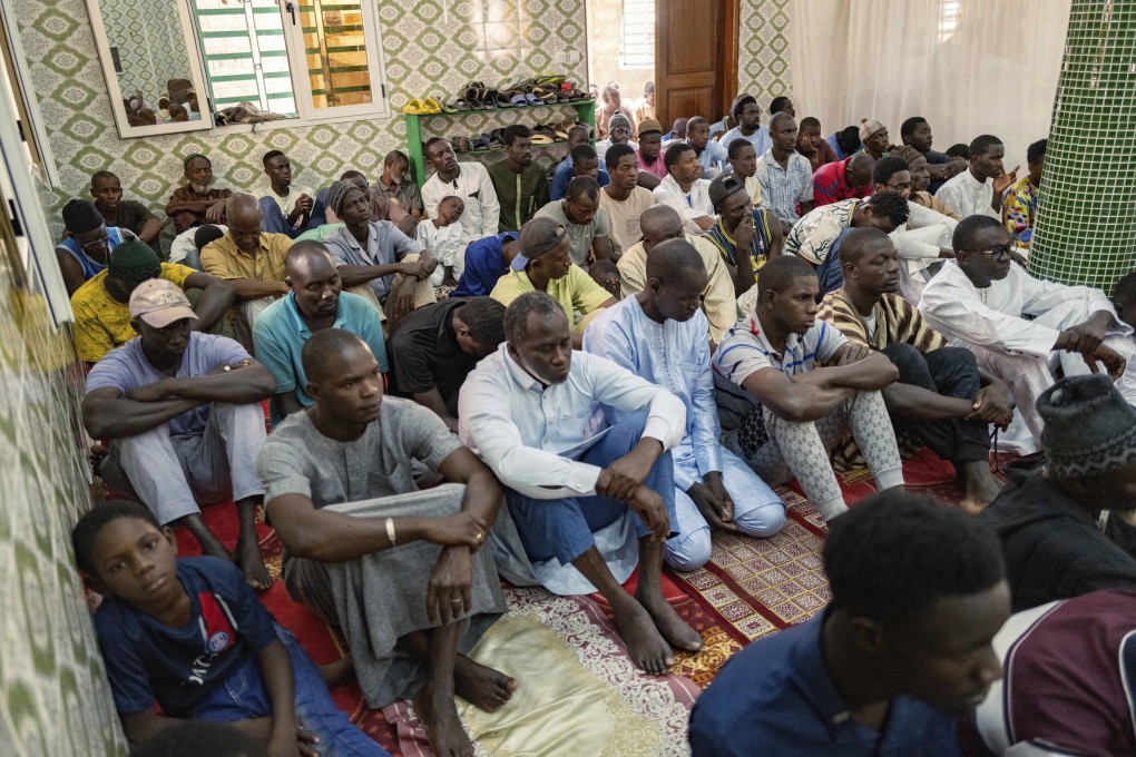 Worshippers listen to Imam Ibrahima Diane, an advocate for gender equality, deliver a sermon at a mosque in Dakar, Senegal, in July. Photo: AP