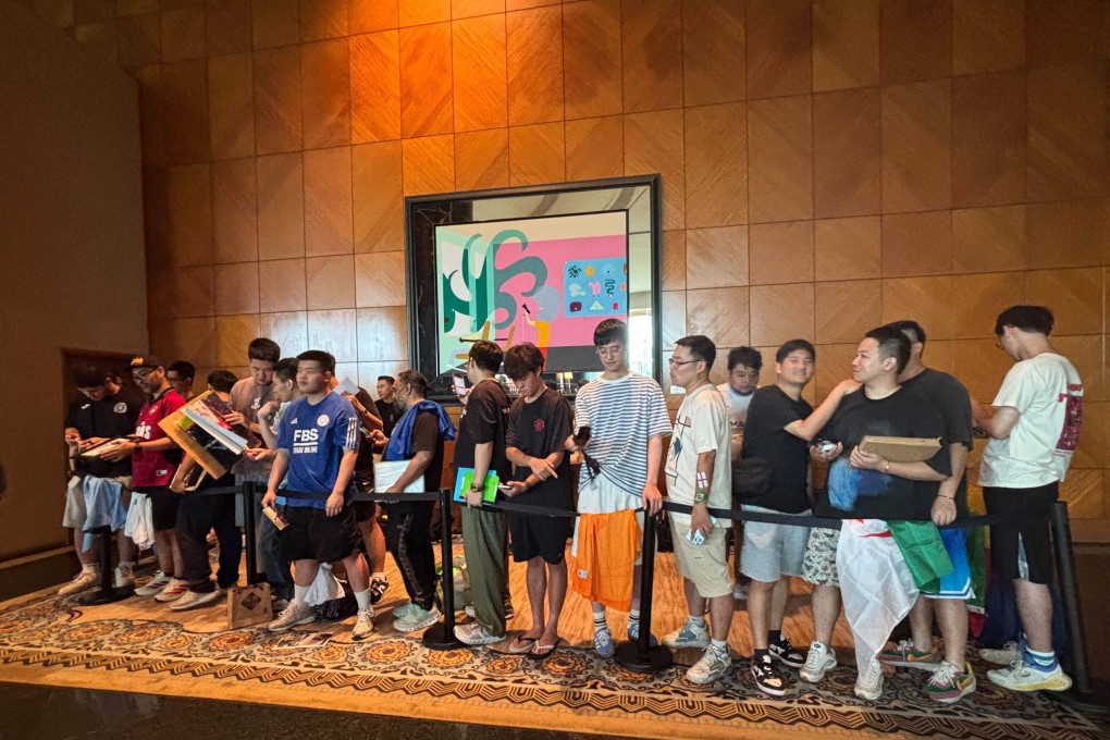 Supporters at the Grand Hyatt Hotel in Wan Chai gather as they wait for the Al-Ahli players to arrive